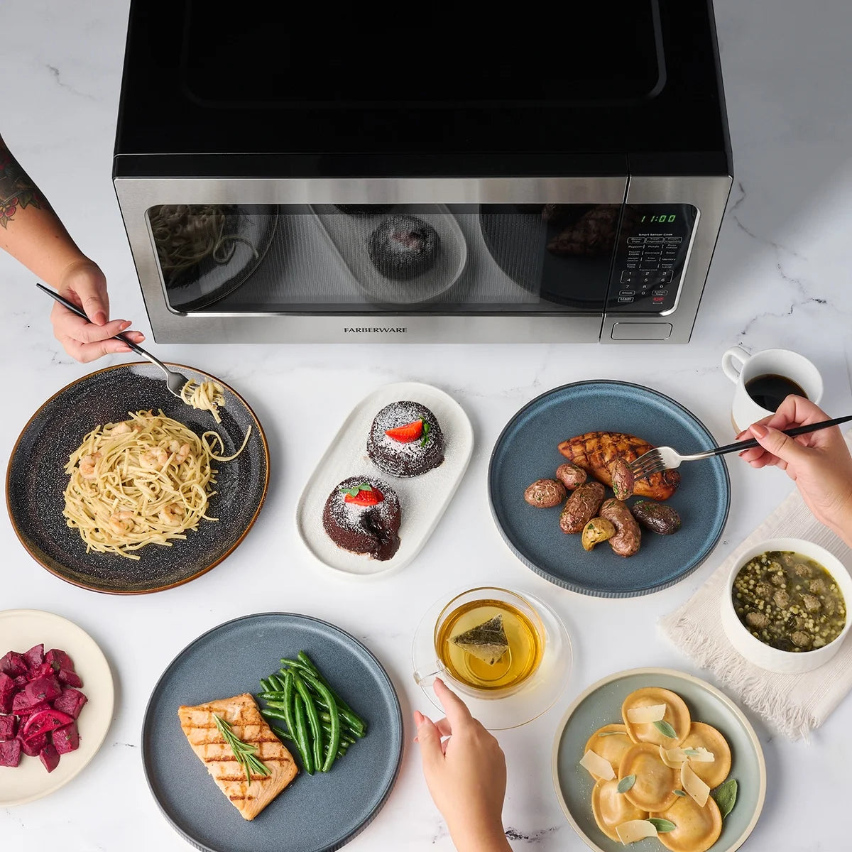 Farberware Countertop Microwave Ov 1100 Watts, 2.2 cu ft - Smart Sensor With LED Lighting and Child Lock - Perfect for Apartments and Dorms - Easy Clean Black Interior, Stainless Steel
