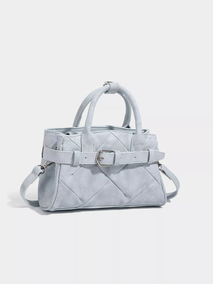 Women's quilted buckle accent crossbody bag